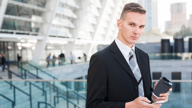 Free photo modern businessman with coffee cup