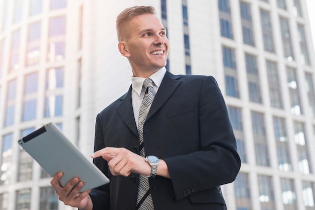 Modern businessman with tablet