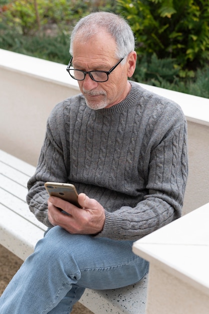 Modern elderly man outdoors