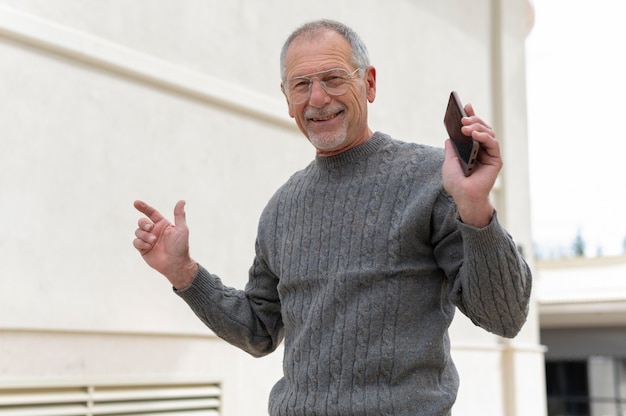 Modern elderly man outdoors