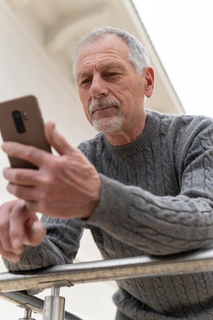 Modern elderly man outdoors