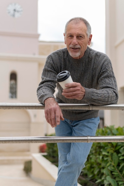 Modern elderly man outdoors