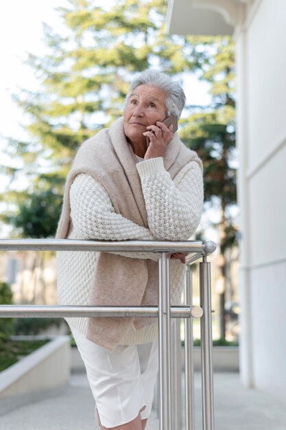 Modern elderly woman living in the city