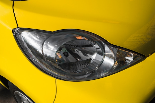 Free Photo modern led headlight of yellow car