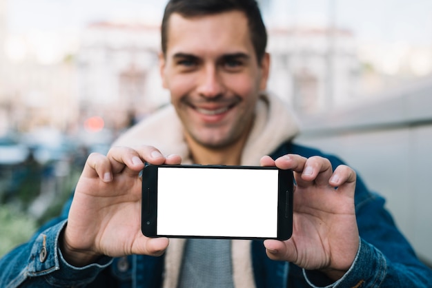 Modern man presenting smartphone template