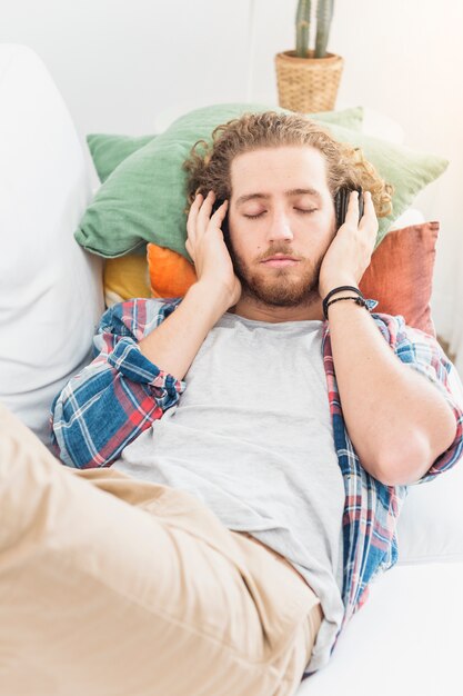 Modern man relaxing on couch