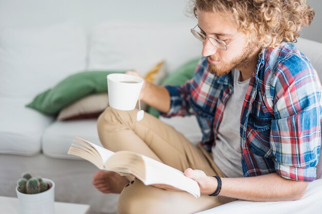 Modern man relaxing on couch