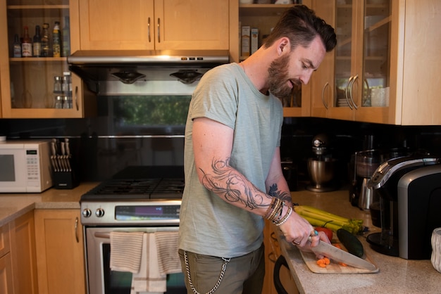 Modern man spending time in the kitchen