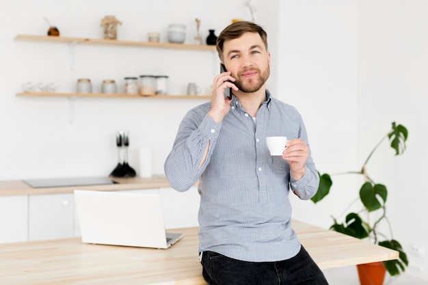 Modern man talking over phone