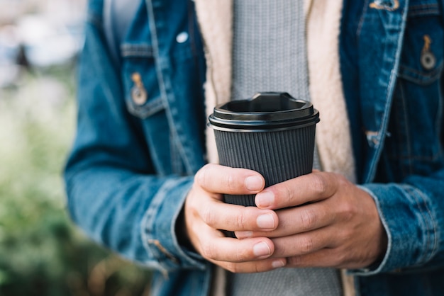 Free photo modern man with coffee cup in urban environment