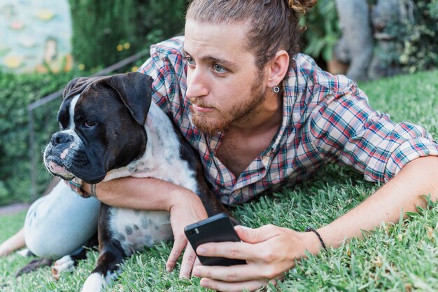 Modern man with dog in garden