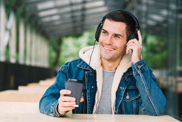 Modern man with headphones in urban environment