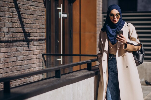 Modern muslim woman talking on the phone