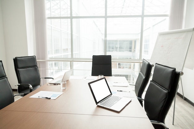 Modern office boardroom interior with conference table and big window