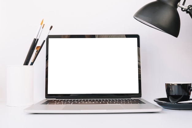 Modern office desk composition with technological device