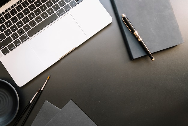 Modern office desk composition with technological device