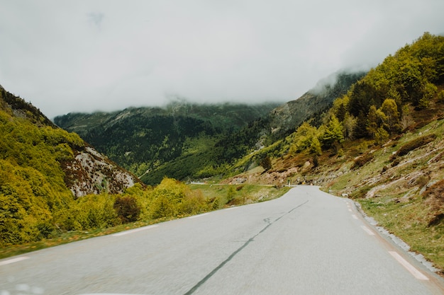 Free Photo modern road surrounded by mountains