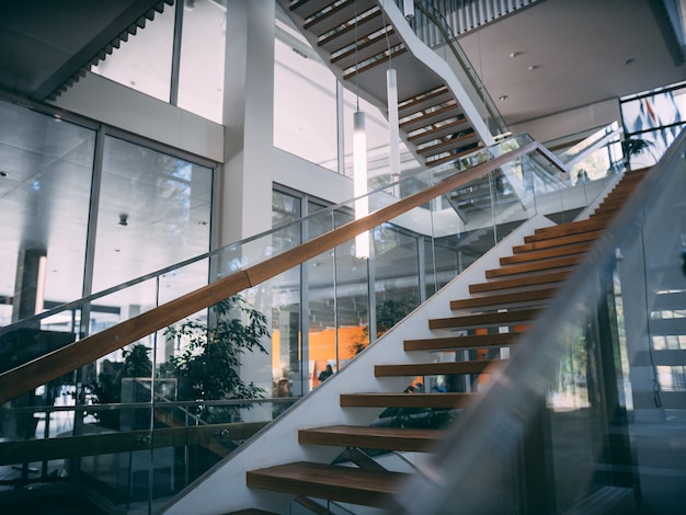 Modern room with a wooden staircase during daytime