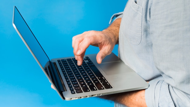 Modern senior man with laptop