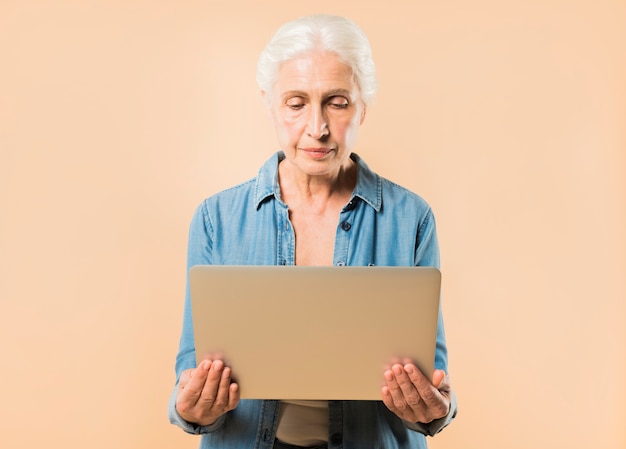 Modern senior woman with laptop