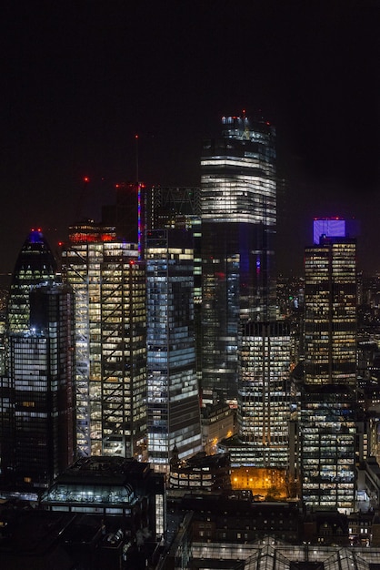 modern skyscrapers with lights under a night sky in London