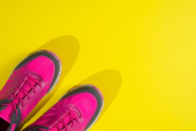 Free photo modern sport composition with colorful trainers