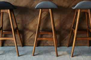 Free photo modern tall wooden bar stools