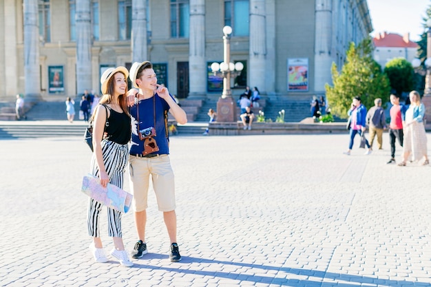 Modern tourist couple visiting city