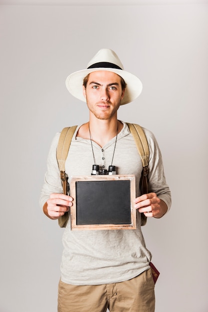 Free photo modern tourist showing slate