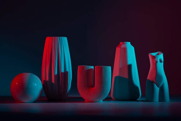 Free photo modern vases with red and blue light assortment