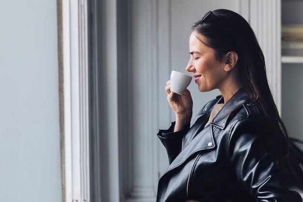 Modern woman drinking coffee