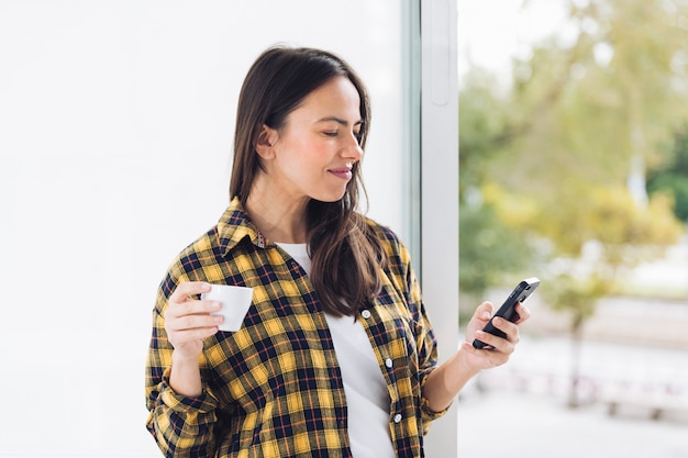 Modern woman drinking coffee