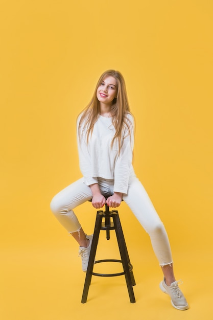 Modern woman on stool