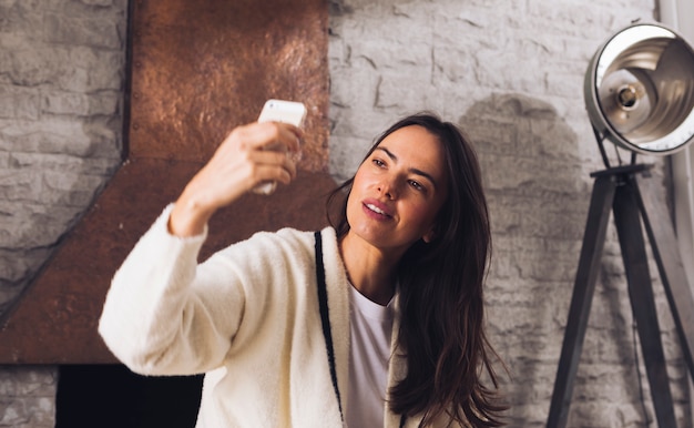 Free Photo modern woman taking a selfie