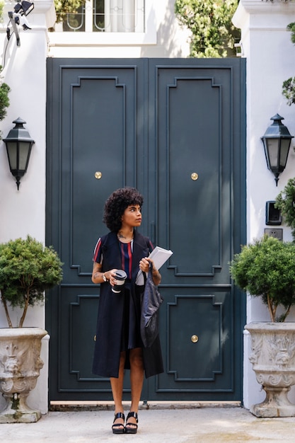 Free photo modern woman walking on the street