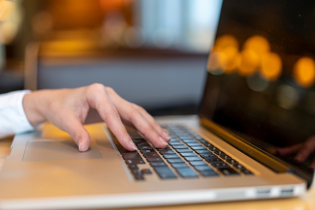 Modern worker typing on laptop