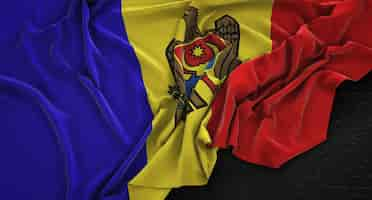 Free photo moldova flag wrinkled on dark background 3d render