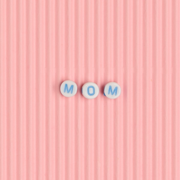 MOM beads text typography on pink