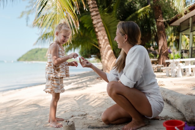 Mom and daughter enjoying their sunny holiday