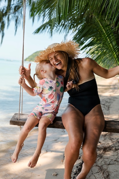 Mom and daughter enjoying their sunny holiday