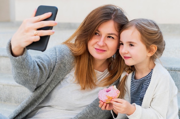 Mom and daughter taking a selfie