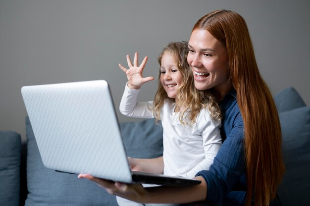 Mom doing a family videocall with her daughter