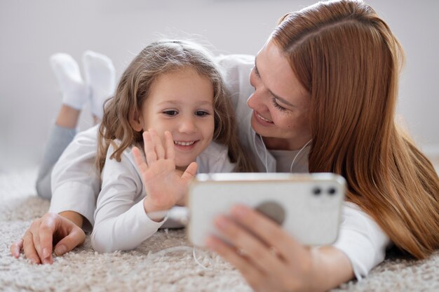 Mom doing a family videocall with her daughter