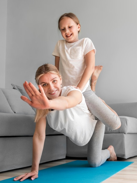 Mom doing sport with girl