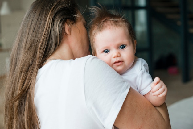 Free Photo mom embracing child at home