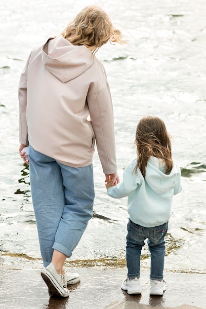 Mom and girl walking together