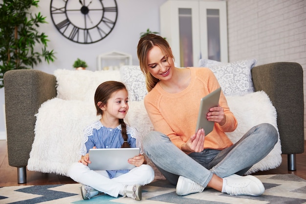 Mom and her child looking at digital tablet