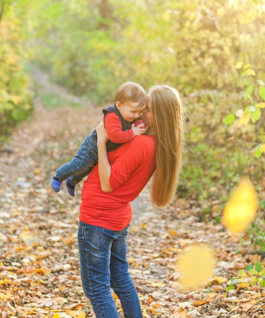 Mom holding tight adorable baby boy