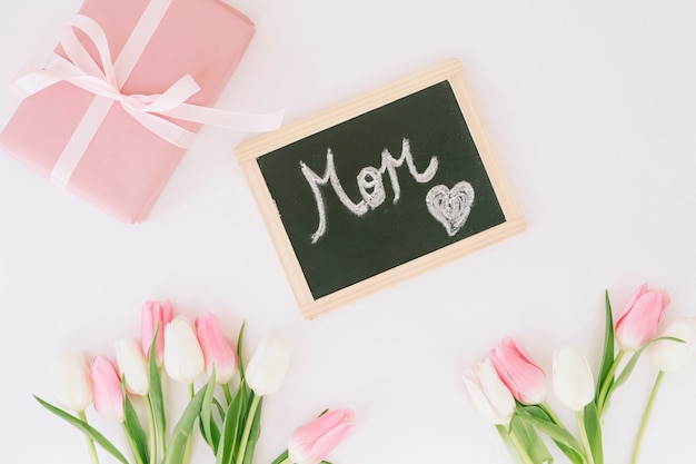 Mom inscription with tulips and gift