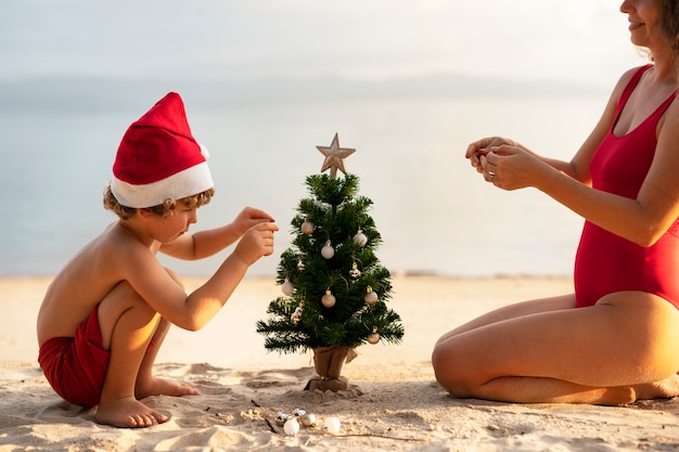 Mom and son celebrating christmas in july